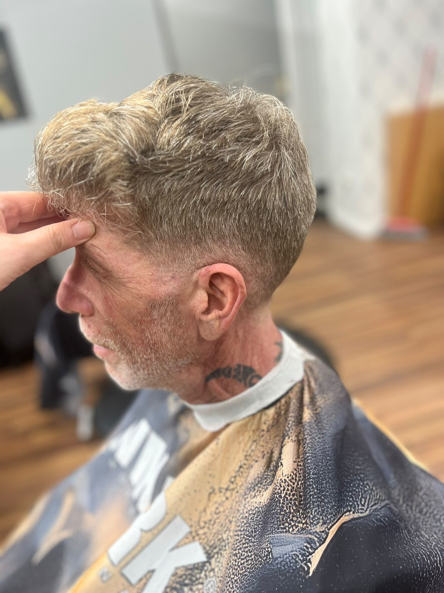 Barber styling a silver textured crop