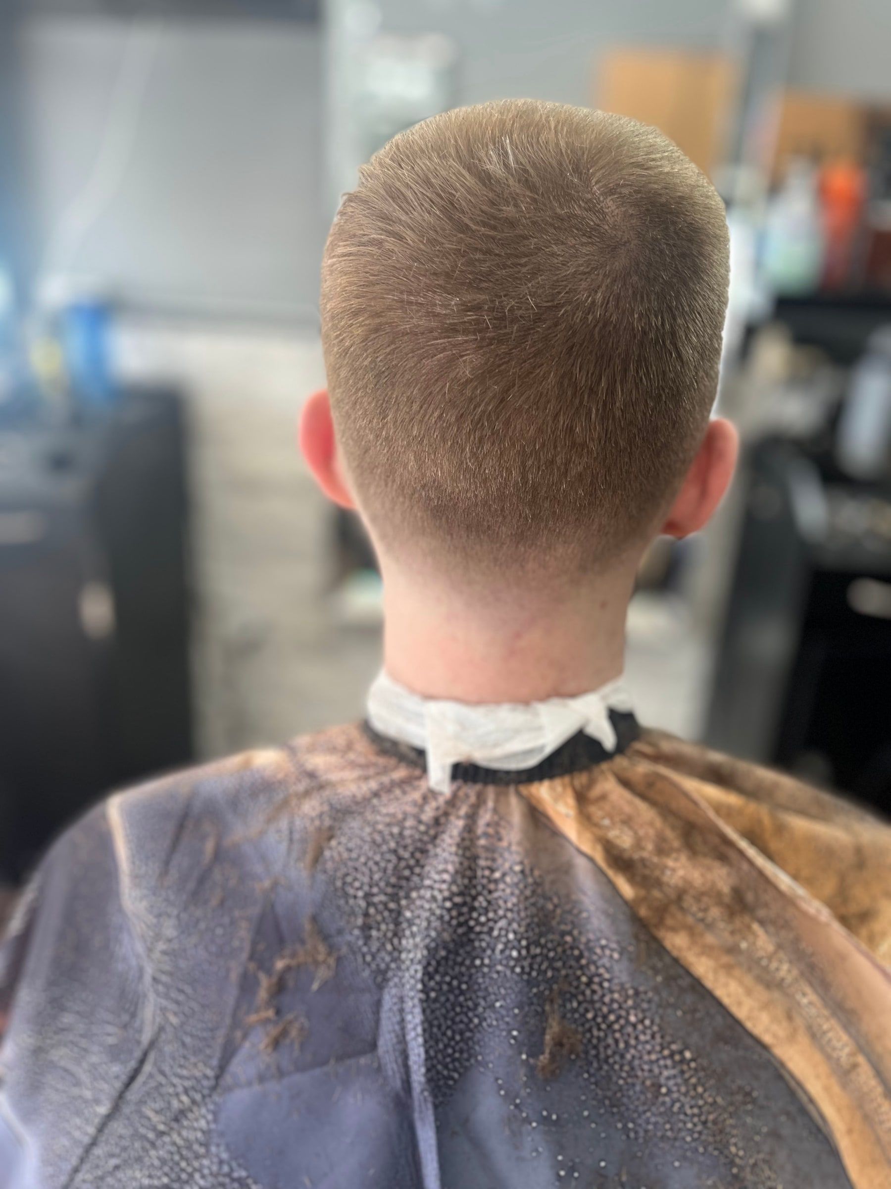 Classic short taper with a squared neckline, back view