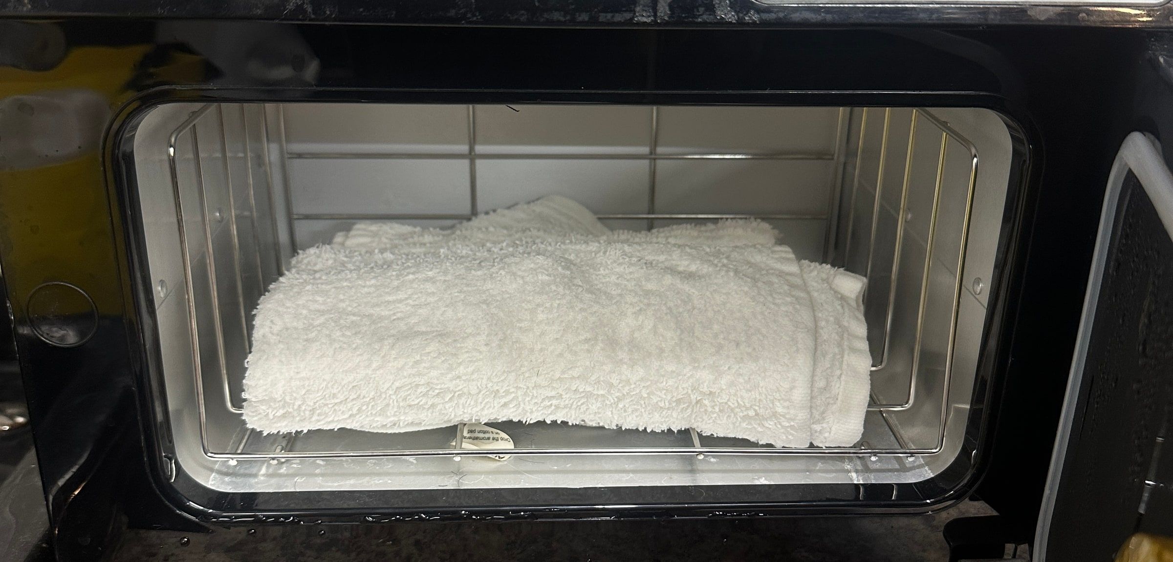Fresh towels warming in the hot towel cabinet