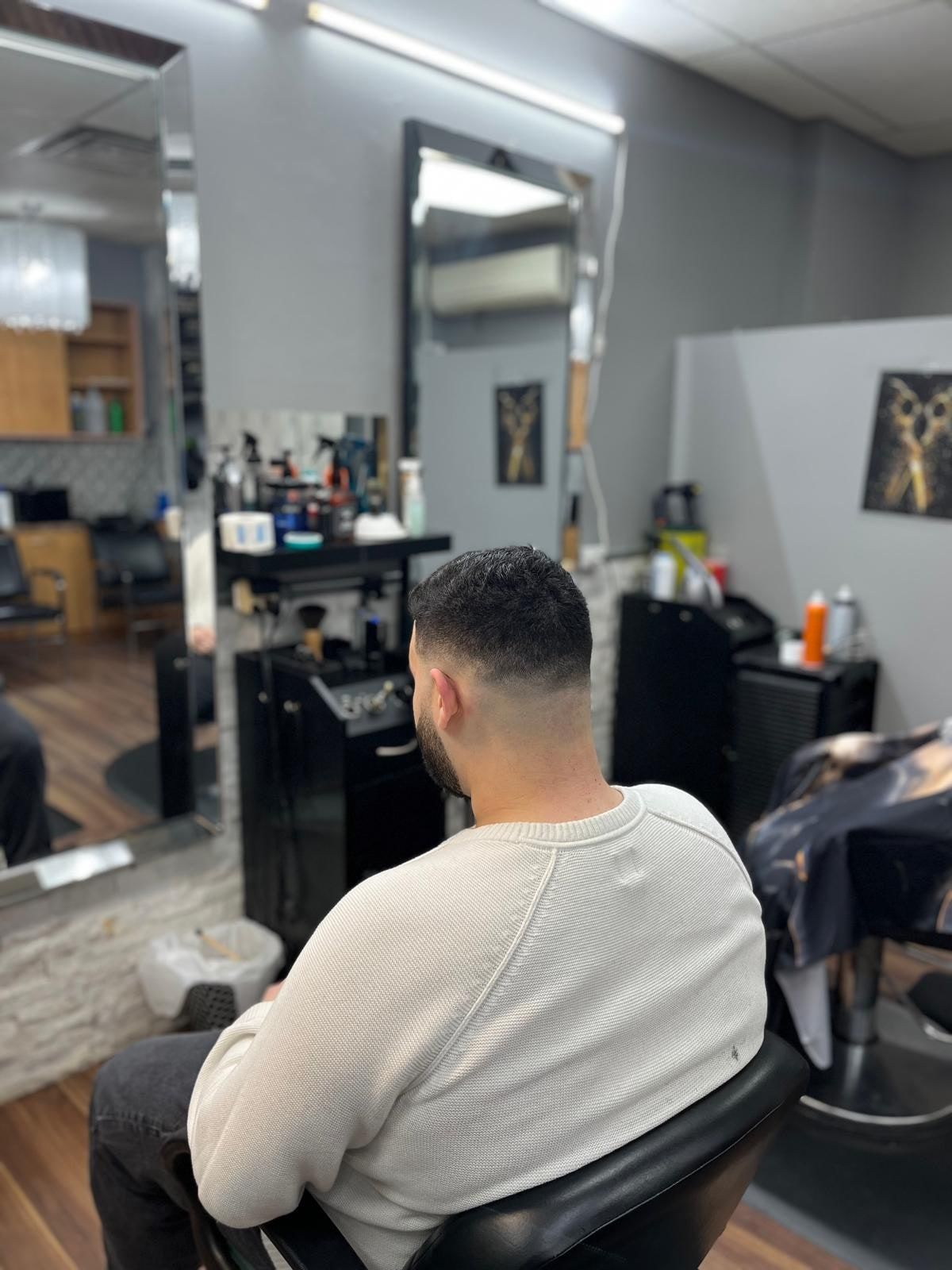 Client in the chair with the shop floor behind